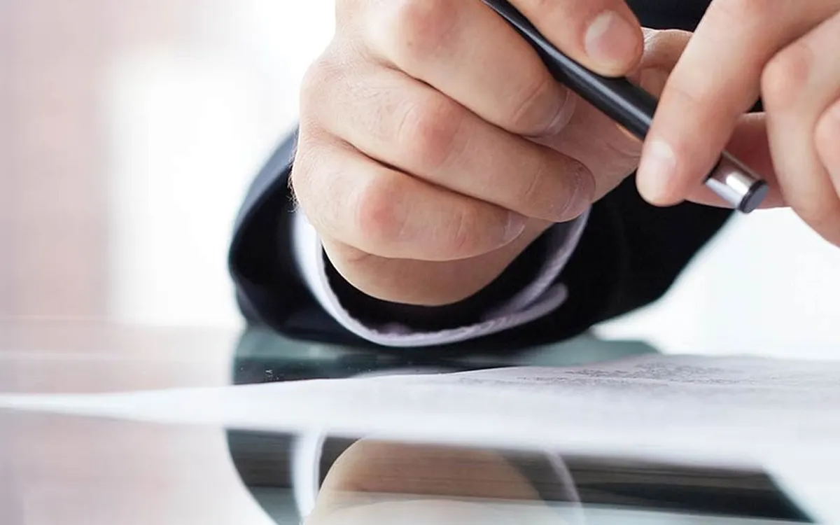 Signing a document with a pen